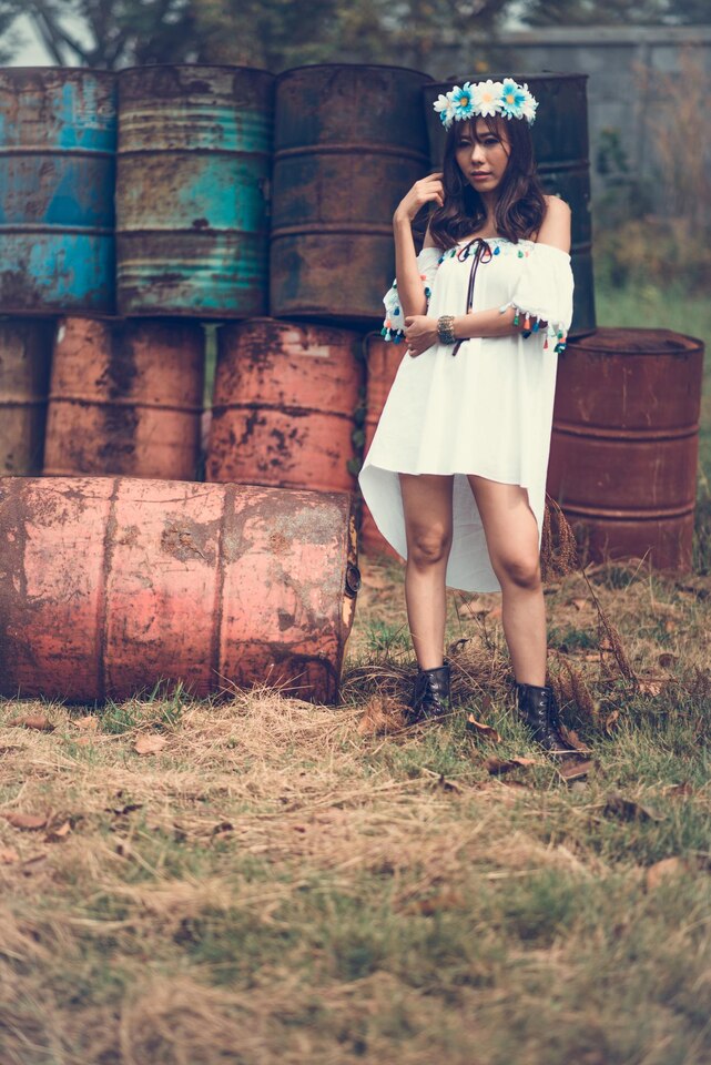 portrait-woman-standing-against-old-containers-field-large _Iconic Hippie Fashion Trends