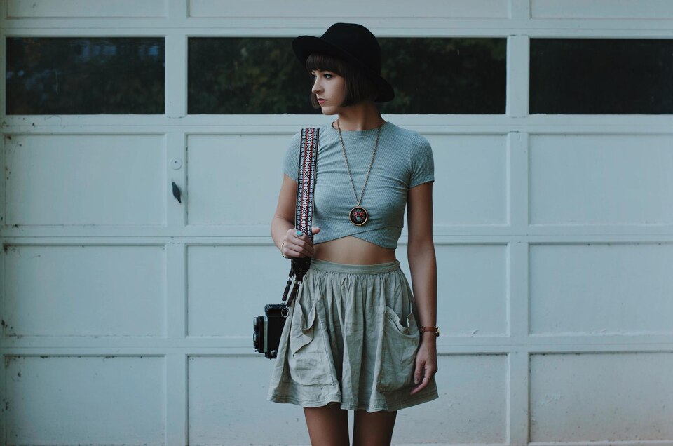 young-woman-standing-against-wall-large